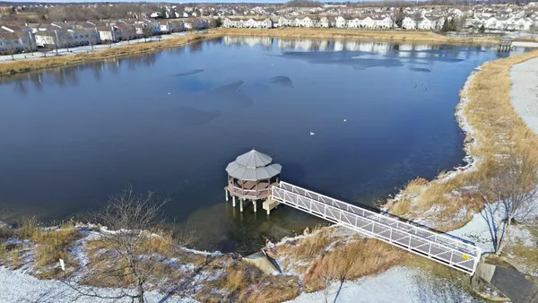 an aerial view of a house with a lake view