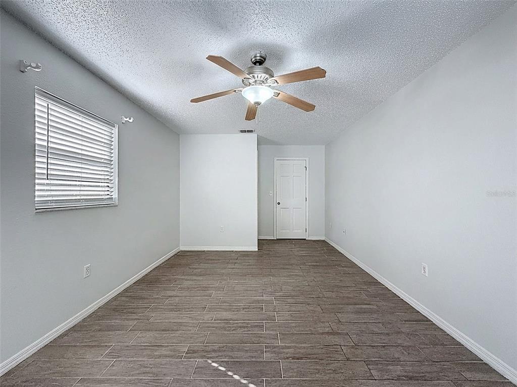 7410 Dundee Court Weeki Wachee, FL 34613 - Photo 17 of 33 a view of an empty room with a window