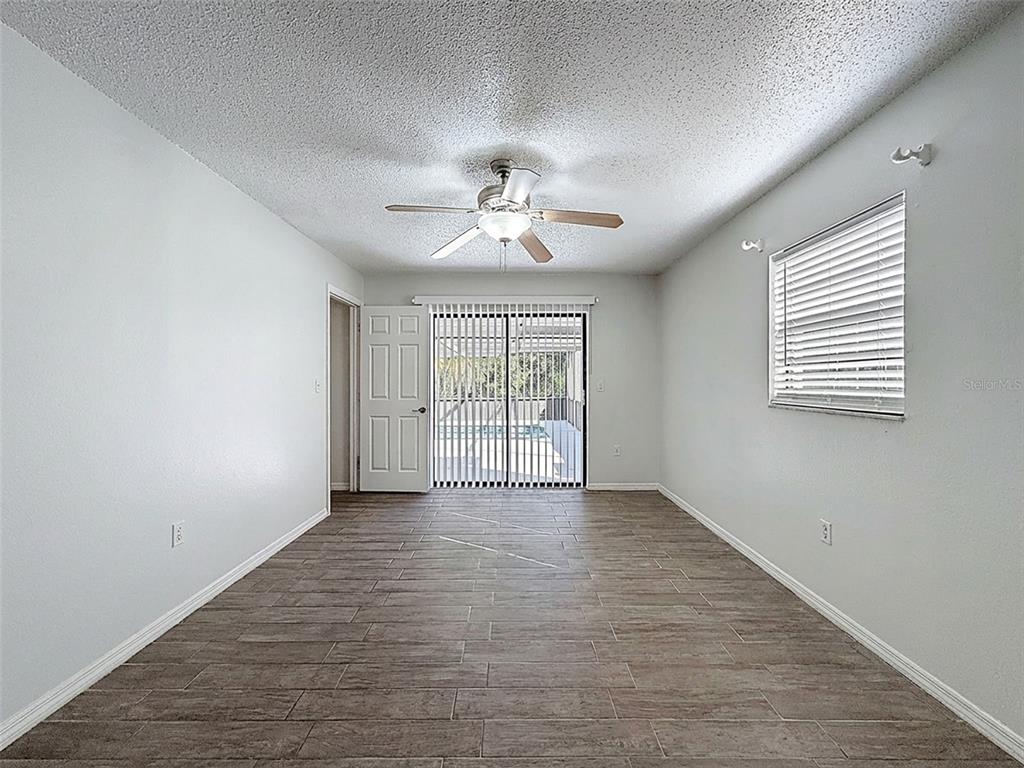 7410 Dundee Court Weeki Wachee, FL 34613 - Photo 19 of 33 a view of an empty room with a window