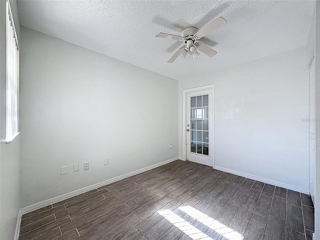 7410 Dundee Court Weeki Wachee, FL 34613 - Photo 21 of 33 a view of an empty room with a window