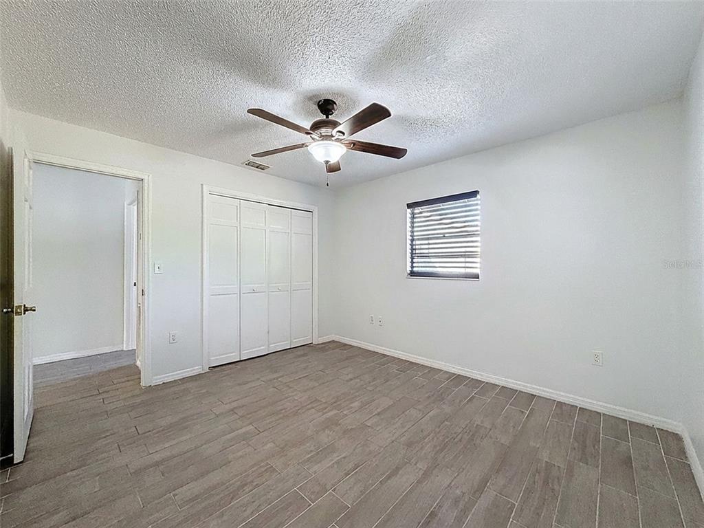 7410 Dundee Court Weeki Wachee, FL 34613 - Photo 24 of 33 a view of an empty room with a window