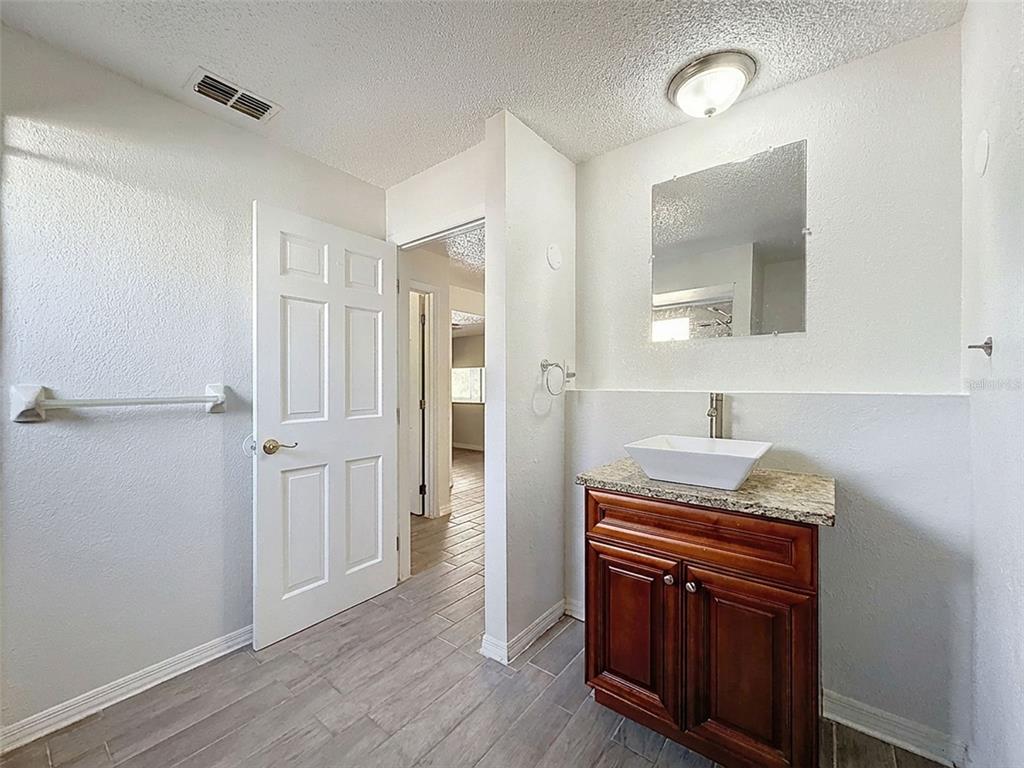 7410 Dundee Court Weeki Wachee, FL 34613 - Photo 27 of 33 a room that has a washer and dryer