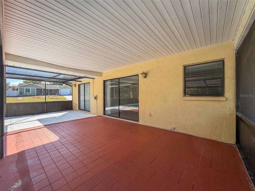 7410 Dundee Court Weeki Wachee, FL 34613 - Photo 29 of 33 a view of an empty room with a fireplace