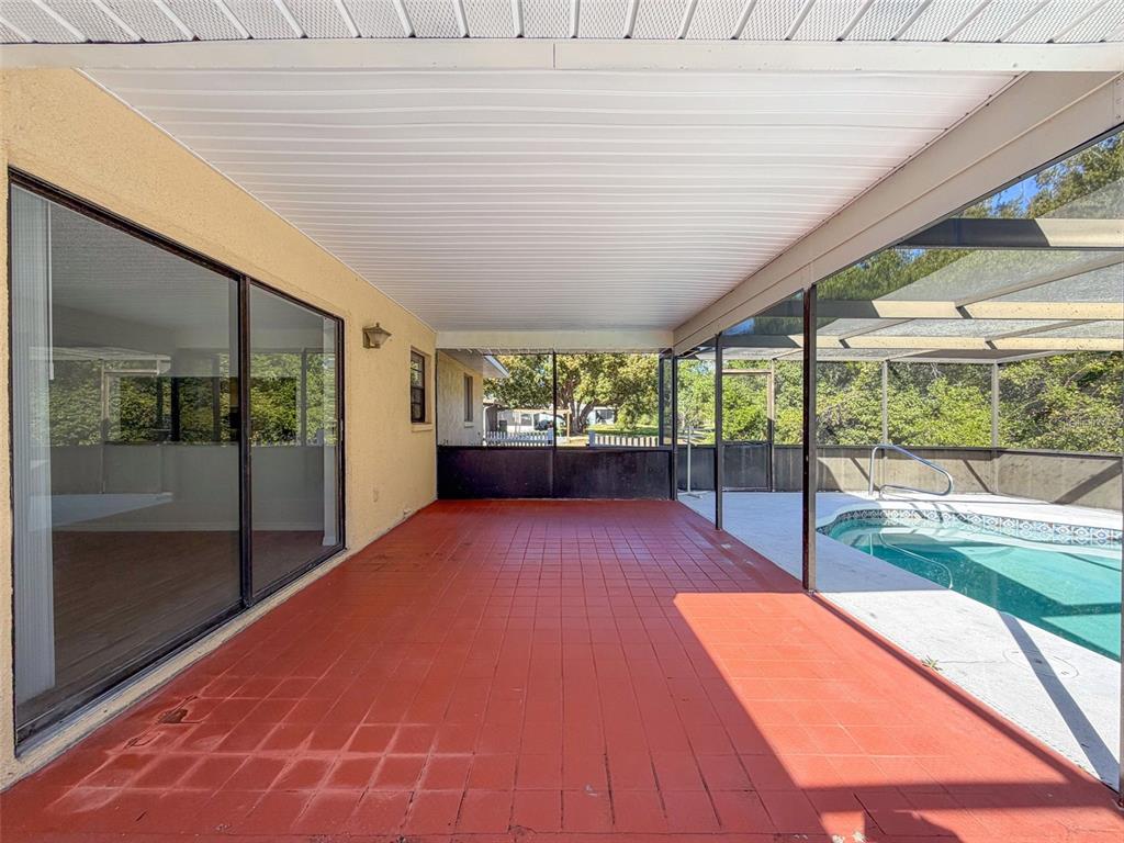 7410 Dundee Court Weeki Wachee, FL 34613 - Photo 30 of 33 a outdoor space with a large window