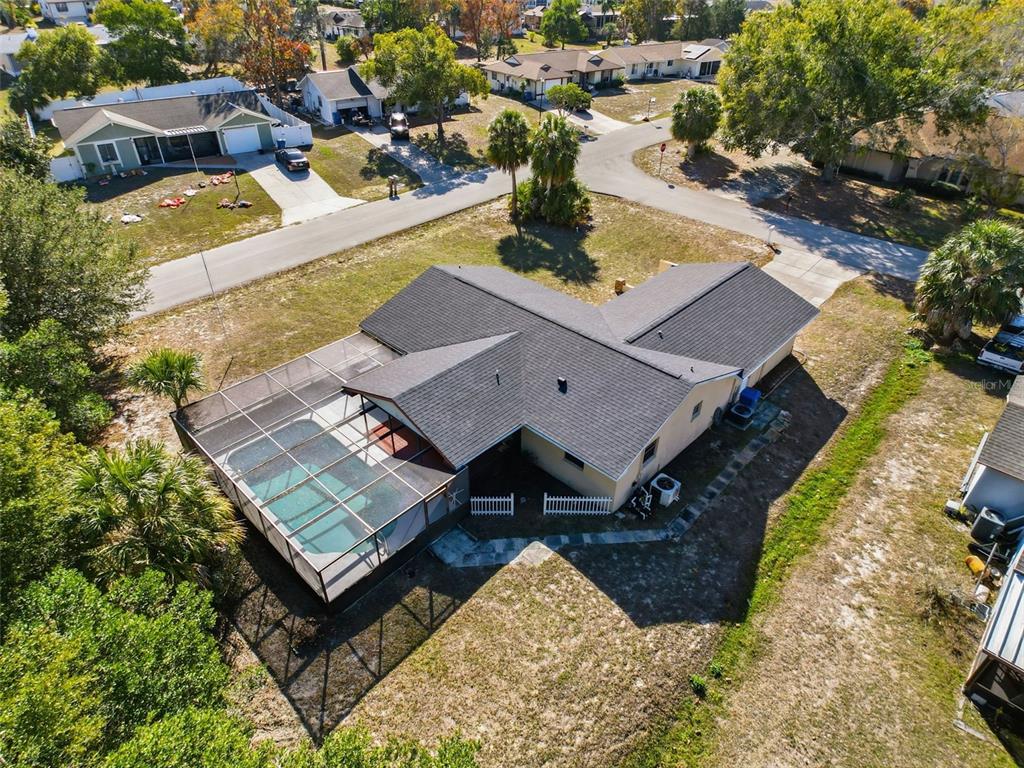 7410 Dundee Court Weeki Wachee, FL 34613 - Photo 3 of 33 an aerial view of a house with a garden