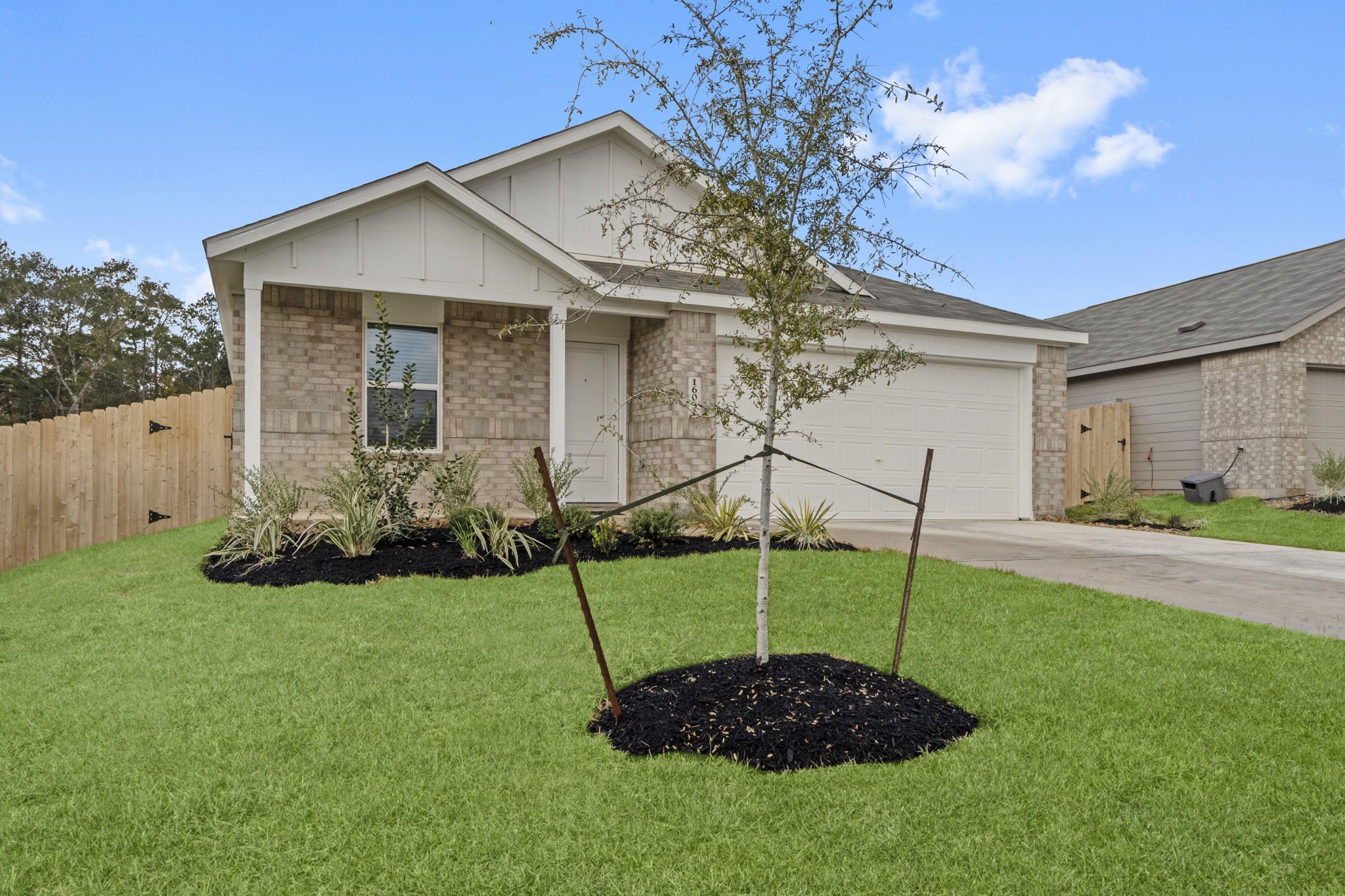 a house view with a garden space