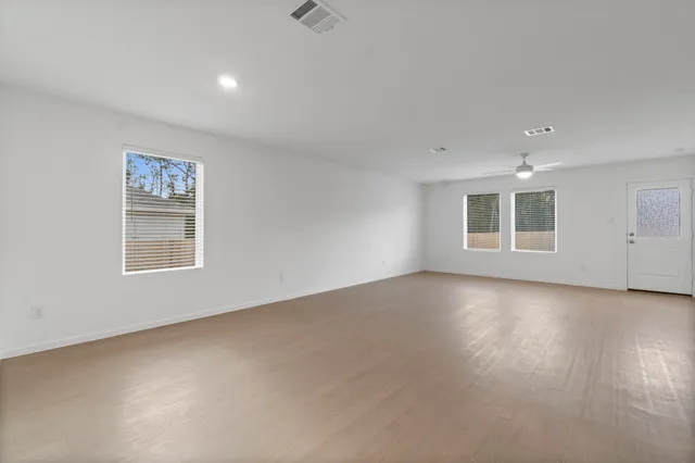 a view of an empty room with a window
