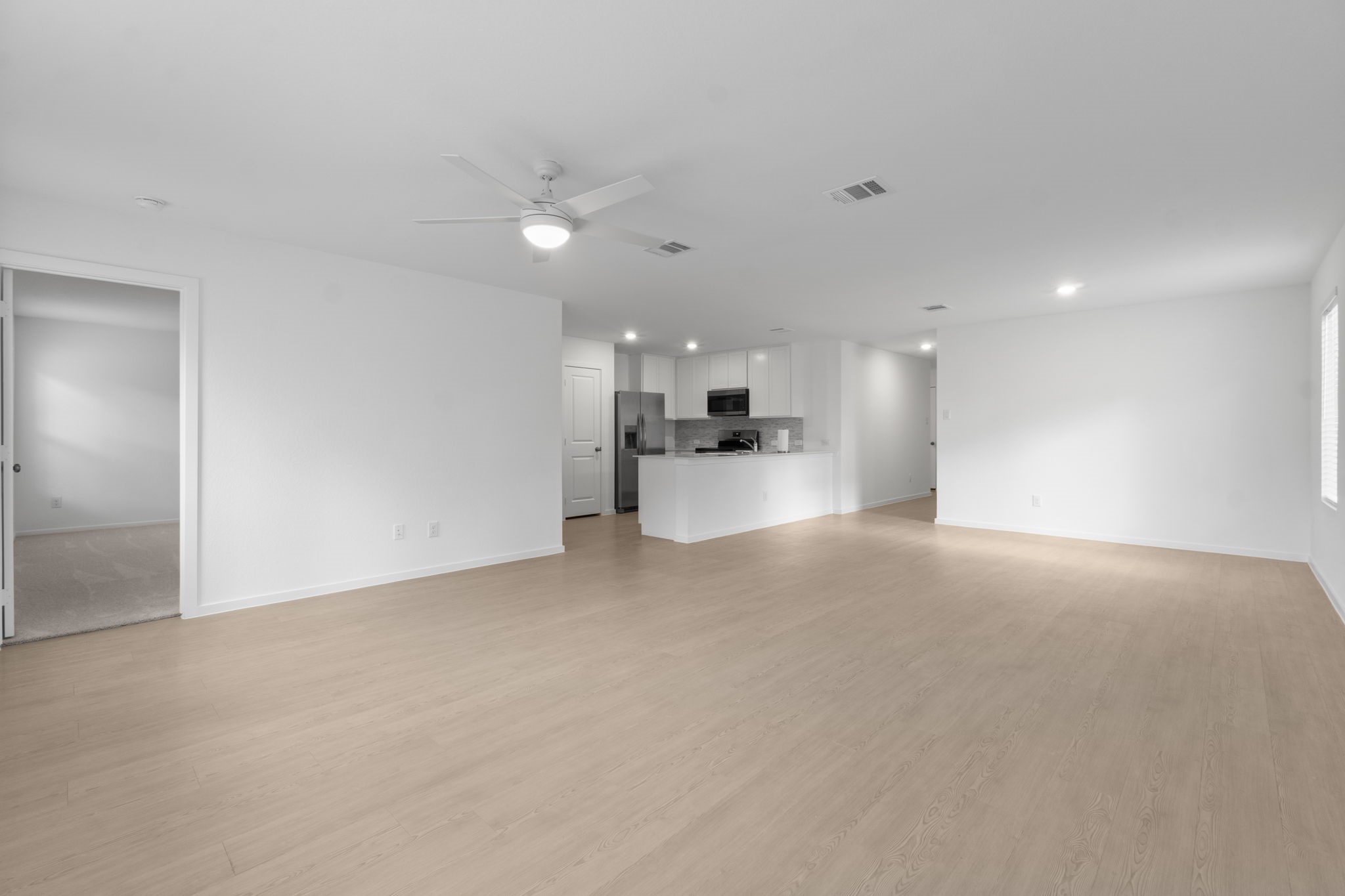 16031 Tallis Drive Conroe, TX 77303 - Photo 16 of 46 a view of a kitchen with a sink stove and a refrigerator