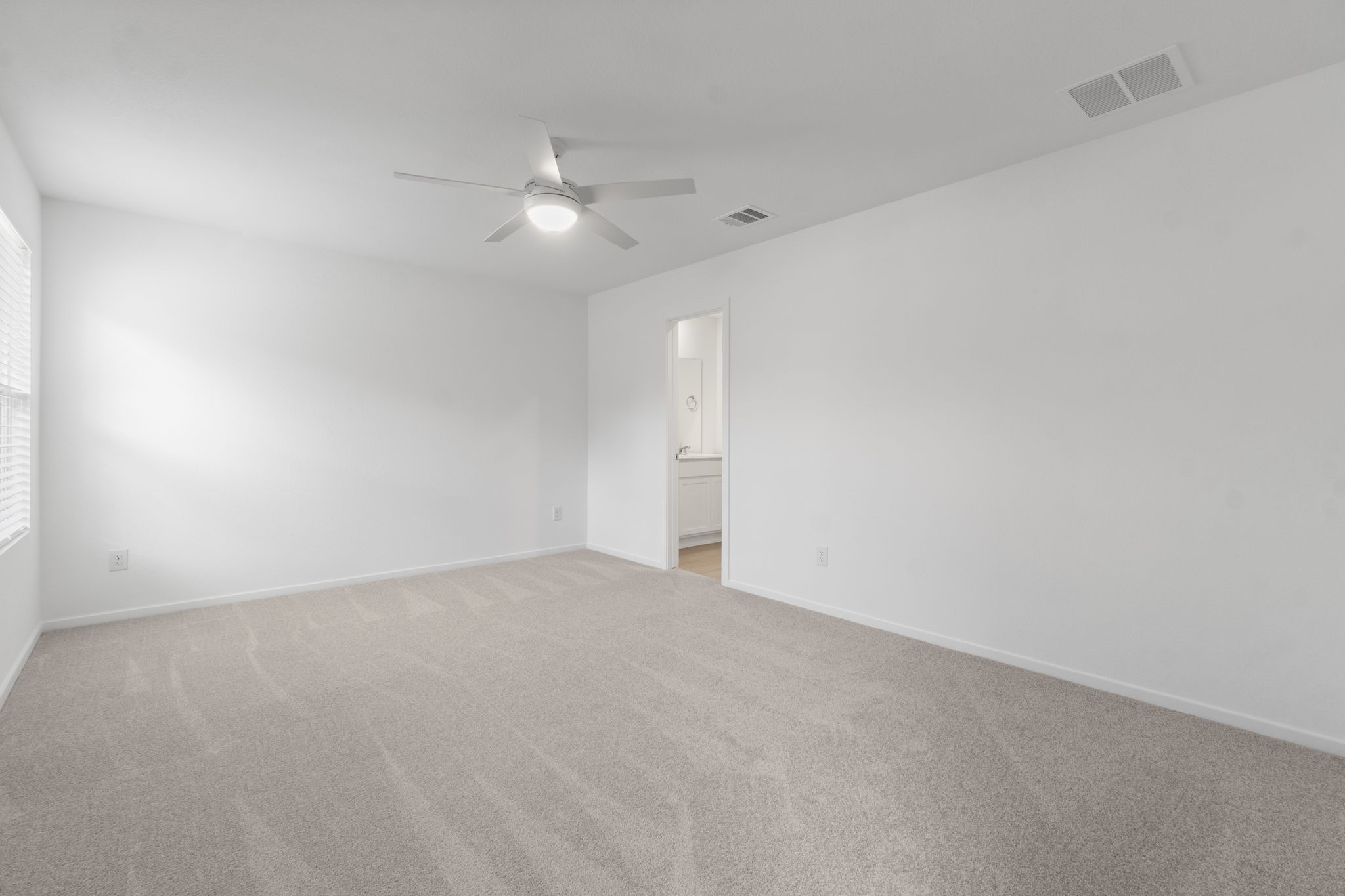 16031 Tallis Drive Conroe, TX 77303 - Photo 22 of 46 an empty room with fan and fan