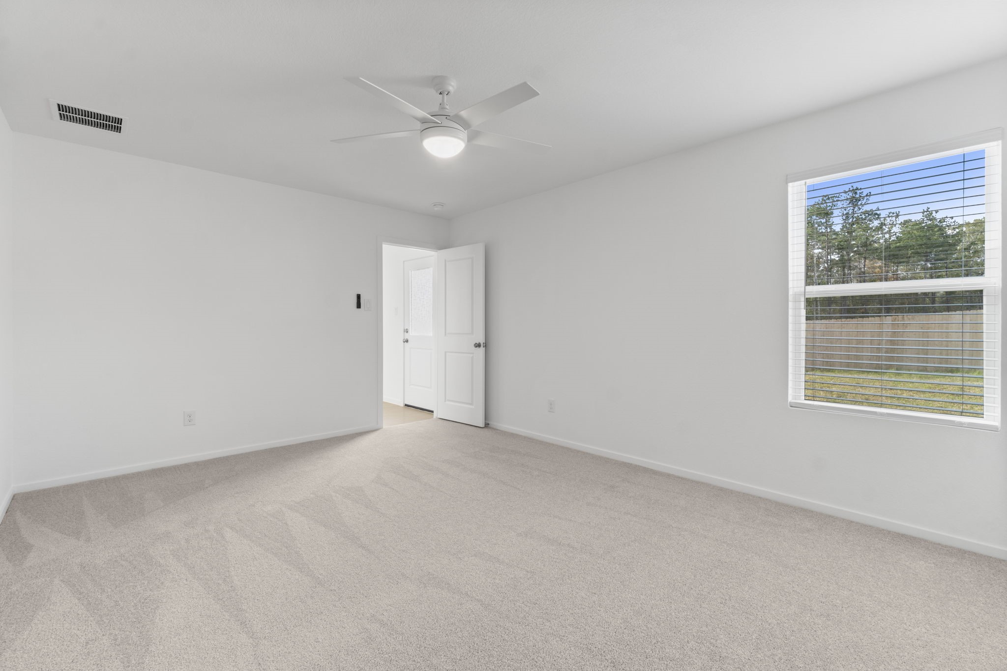 16031 Tallis Drive Conroe, TX 77303 - Photo 24 of 46 a view of an empty room with a window