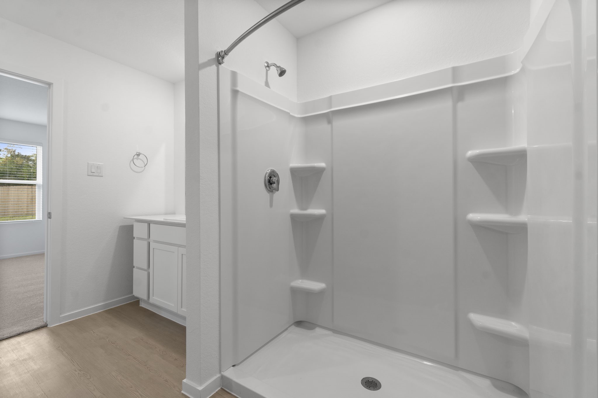 16031 Tallis Drive Conroe, TX 77303 - Photo 26 of 46 a bathroom with a sink and glass door shower