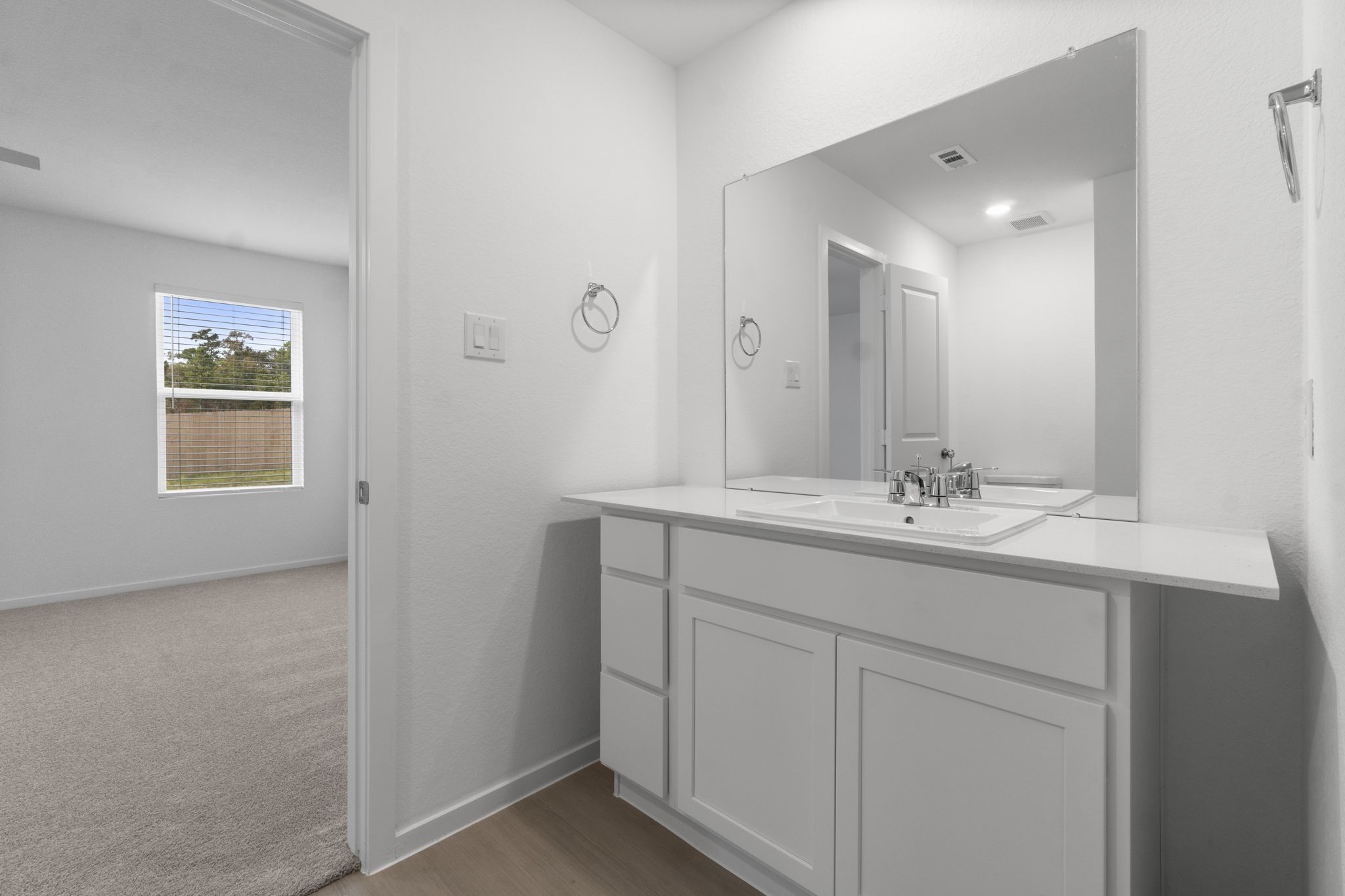 16031 Tallis Drive Conroe, TX 77303 - Photo 27 of 46 a bathroom with a sink and a mirror