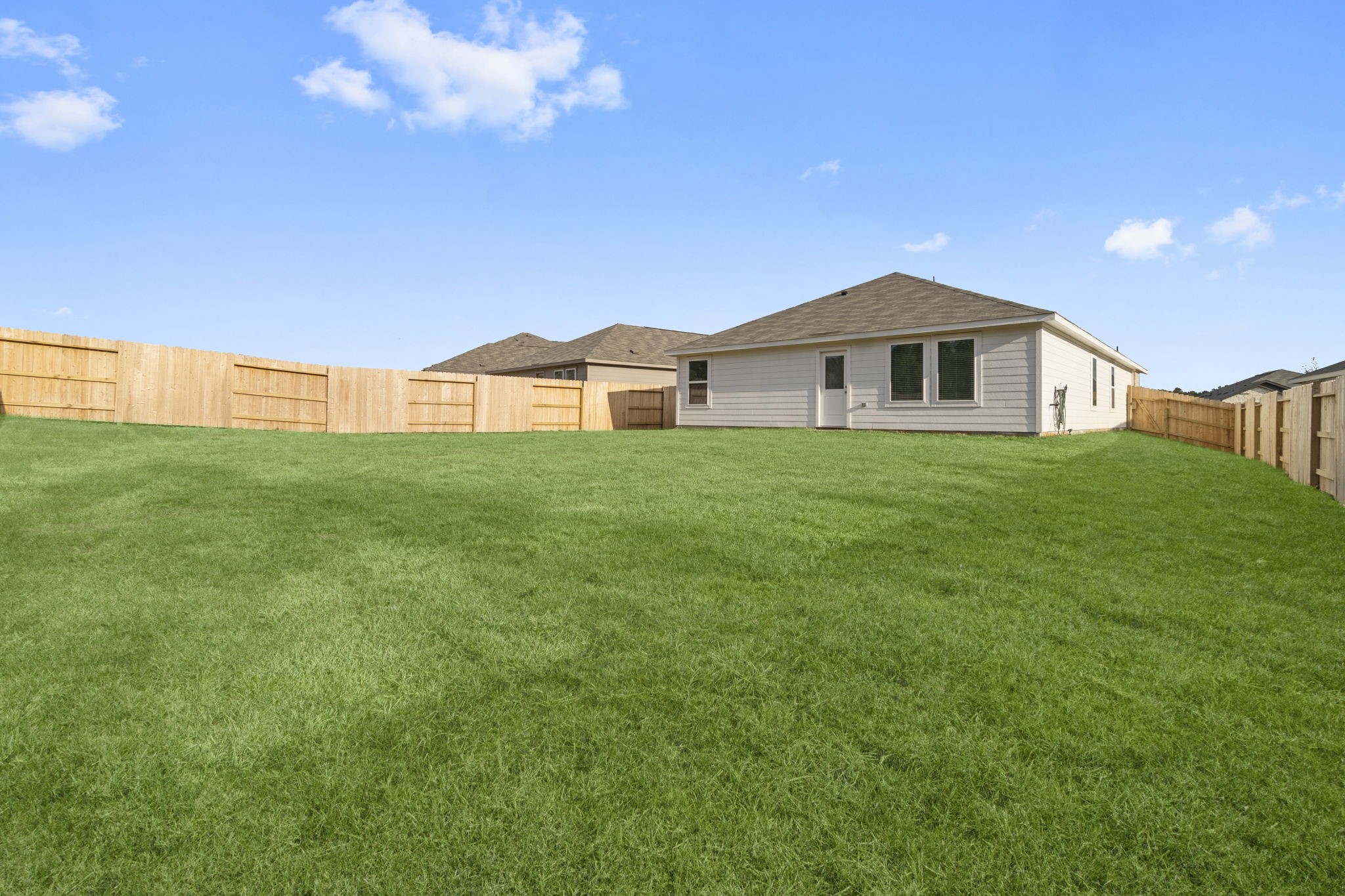 16031 Tallis Drive Conroe, TX 77303 - Photo 30 of 46 a front view of a house with a yard