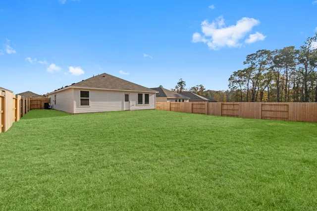a view of yard with a play ground in front of the house