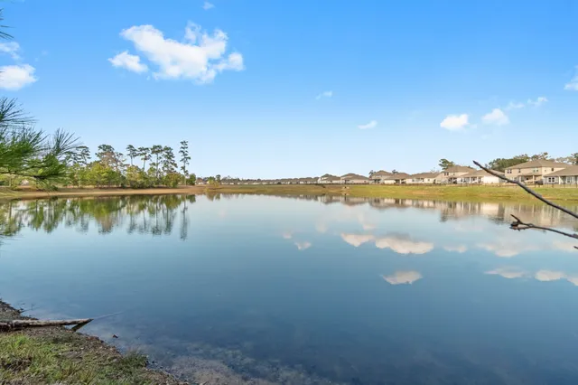 a view of a lake with a big yard