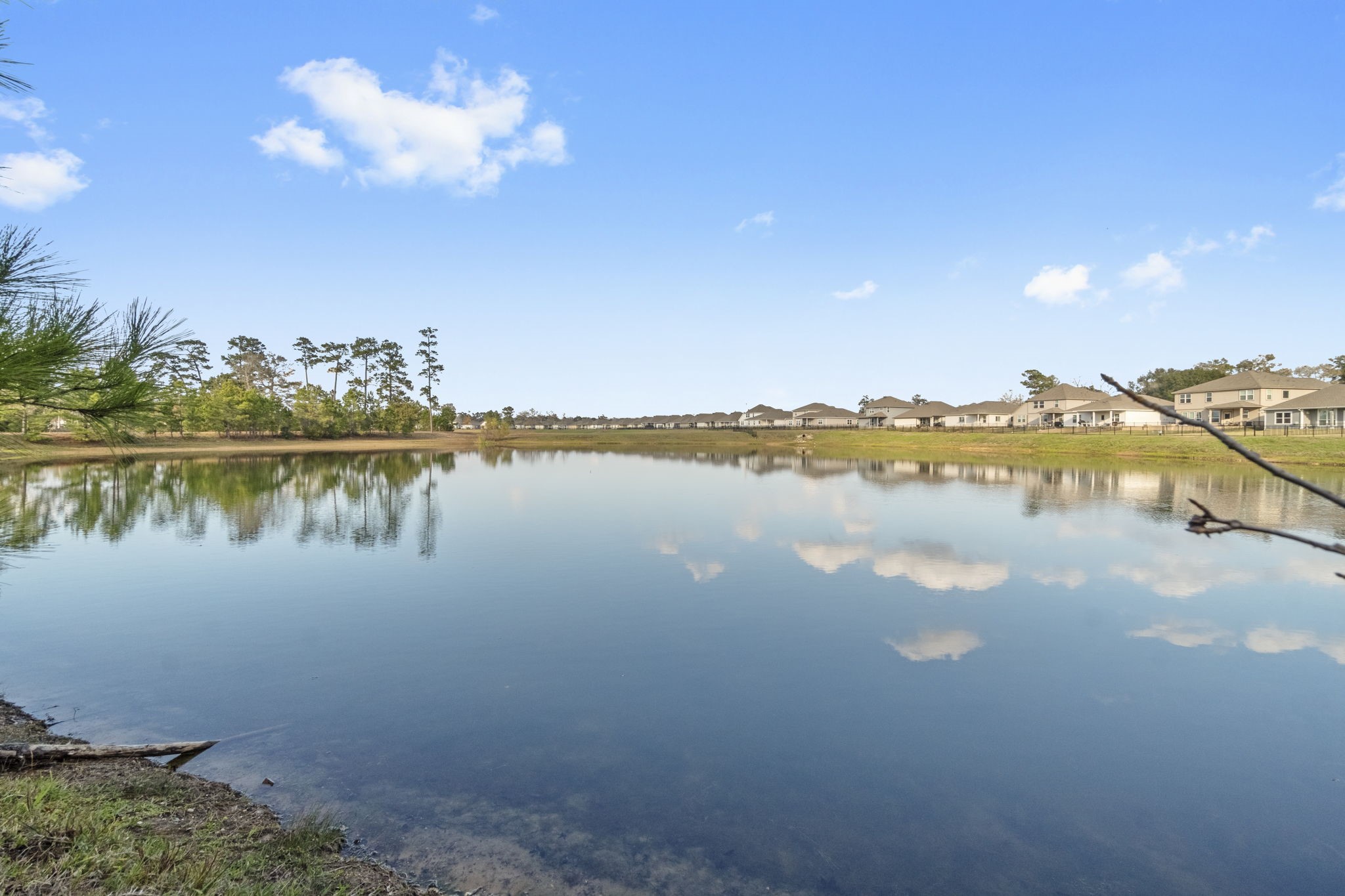 16031 Tallis Drive Conroe, TX 77303 - Photo 43 of 46 a view of a lake with a city