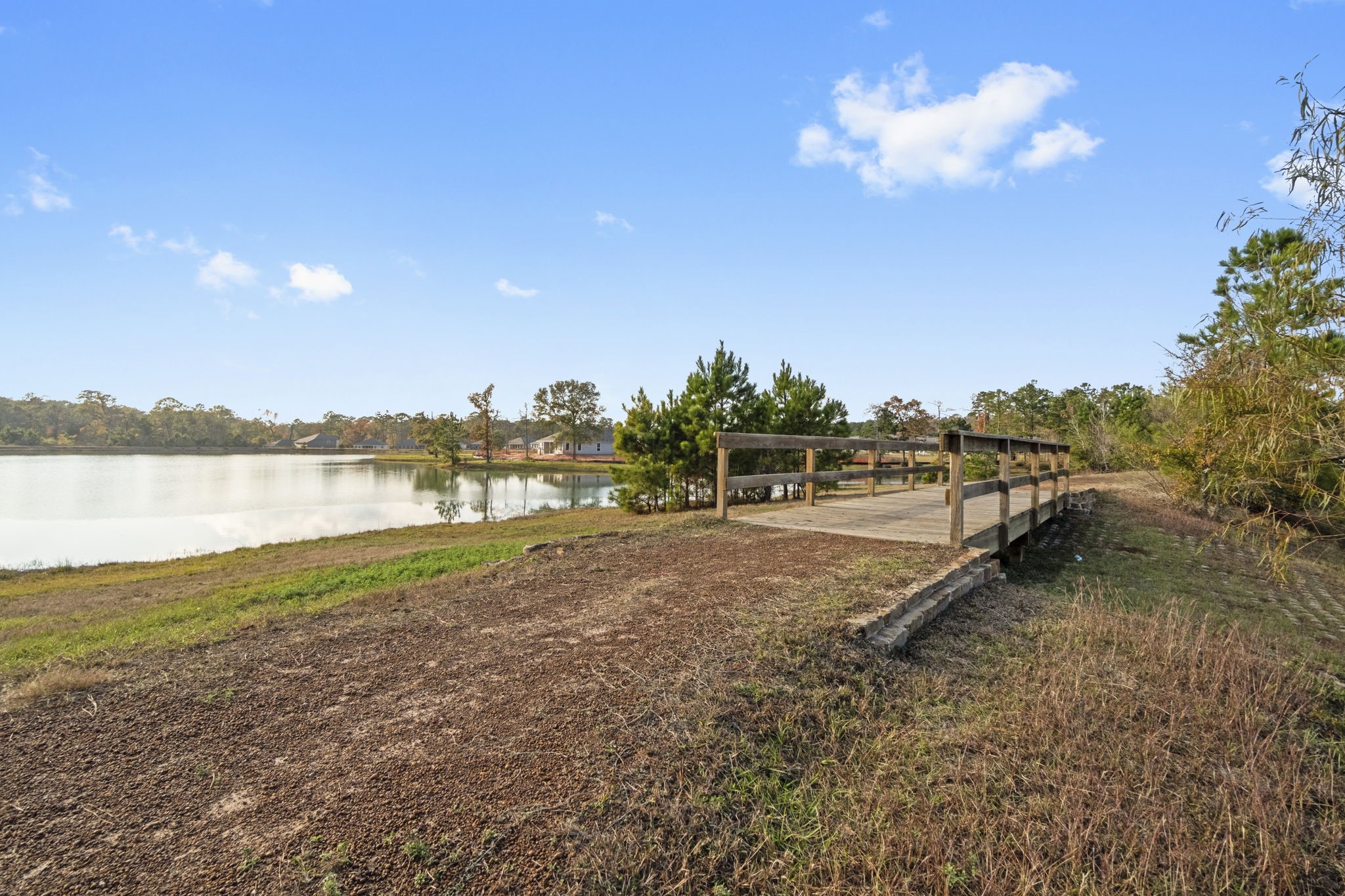 16031 Tallis Drive Conroe, TX 77303 - Photo 44 of 46 a view of a lake with a big yard