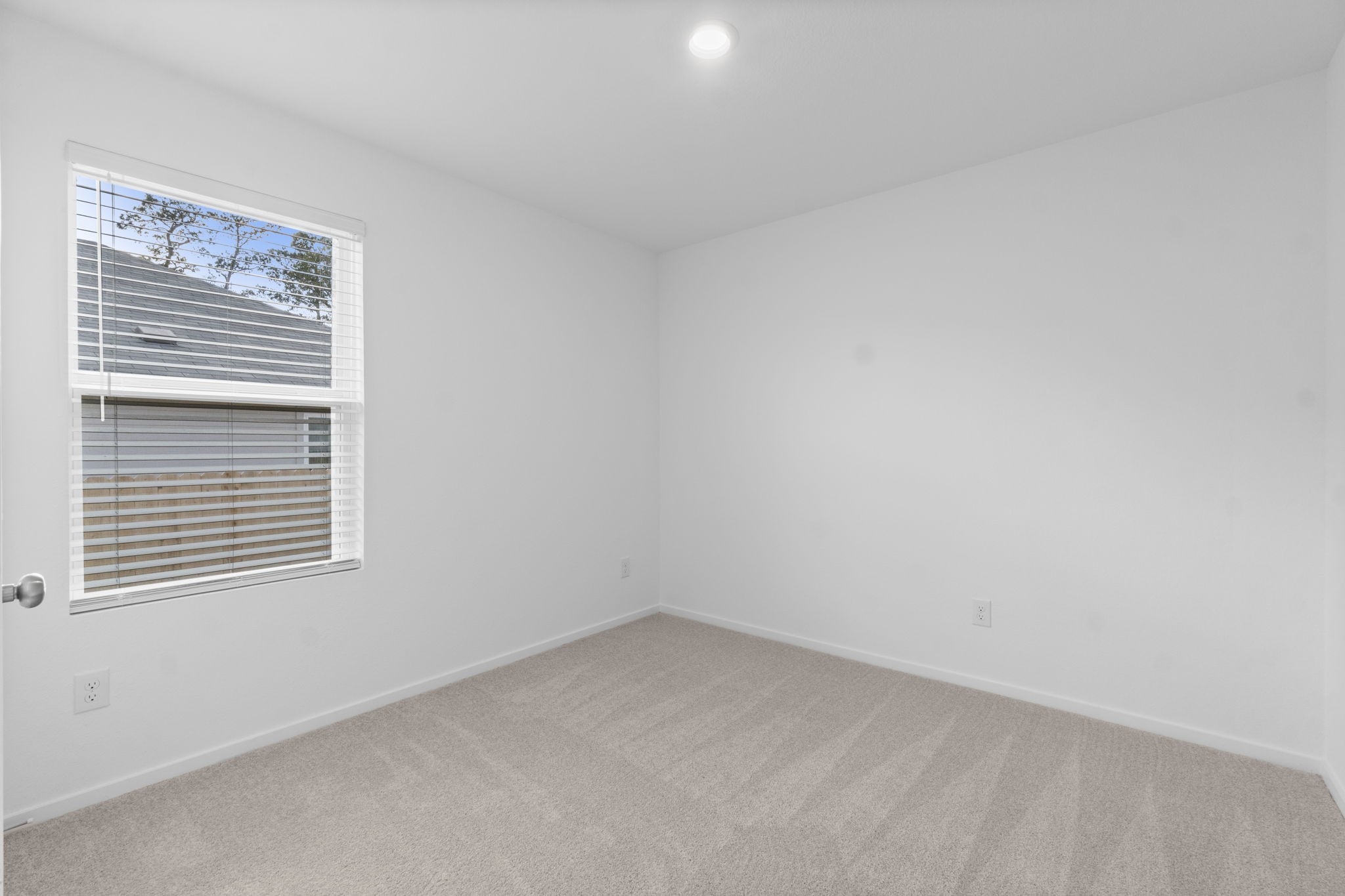 16031 Tallis Drive Conroe, TX 77303 - Photo 9 of 46 a view of an empty room with a window