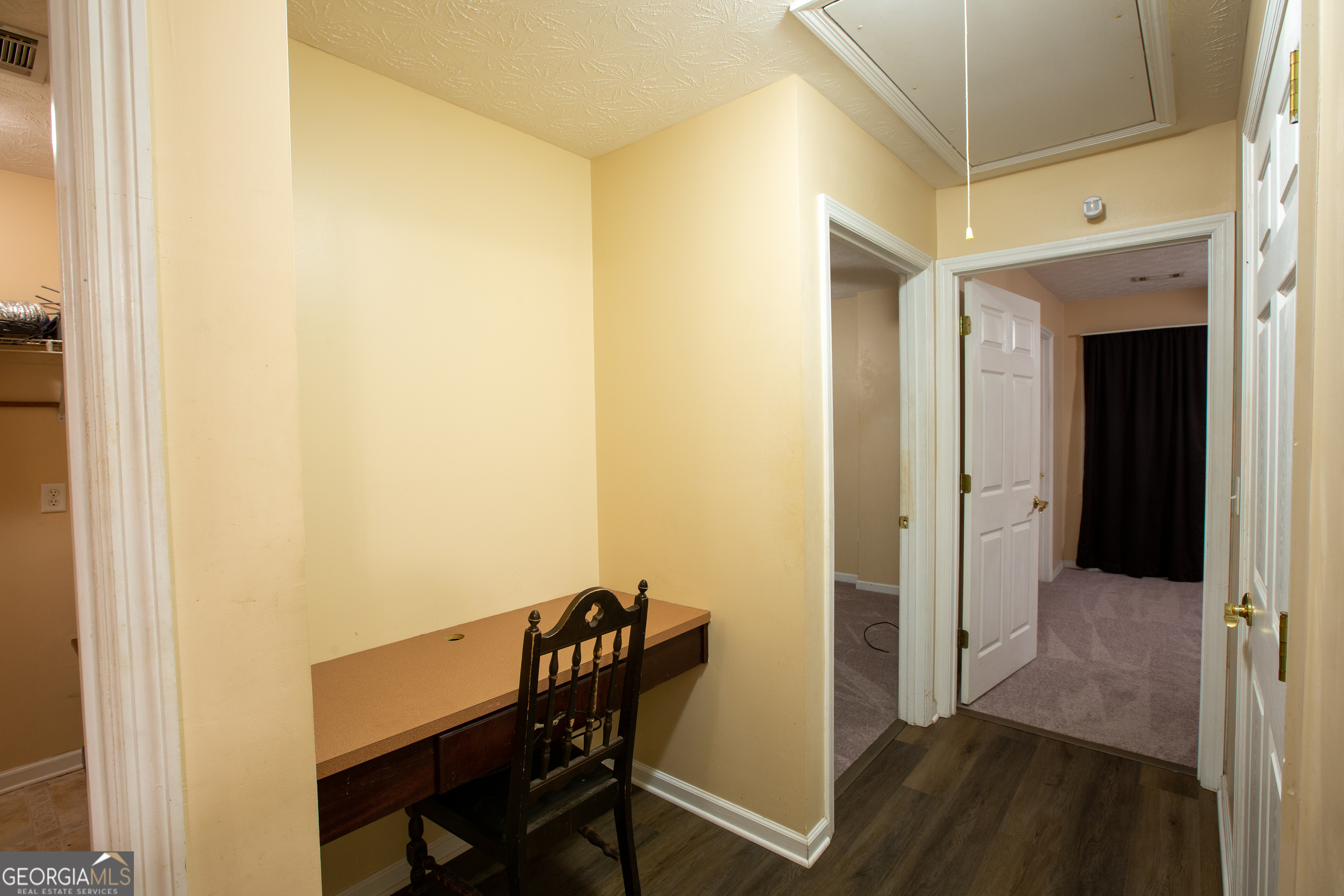 2801 8th Street Columbus, GA 31906 - Photo 14 of 20 a view of a hallway with furniture and wooden floor