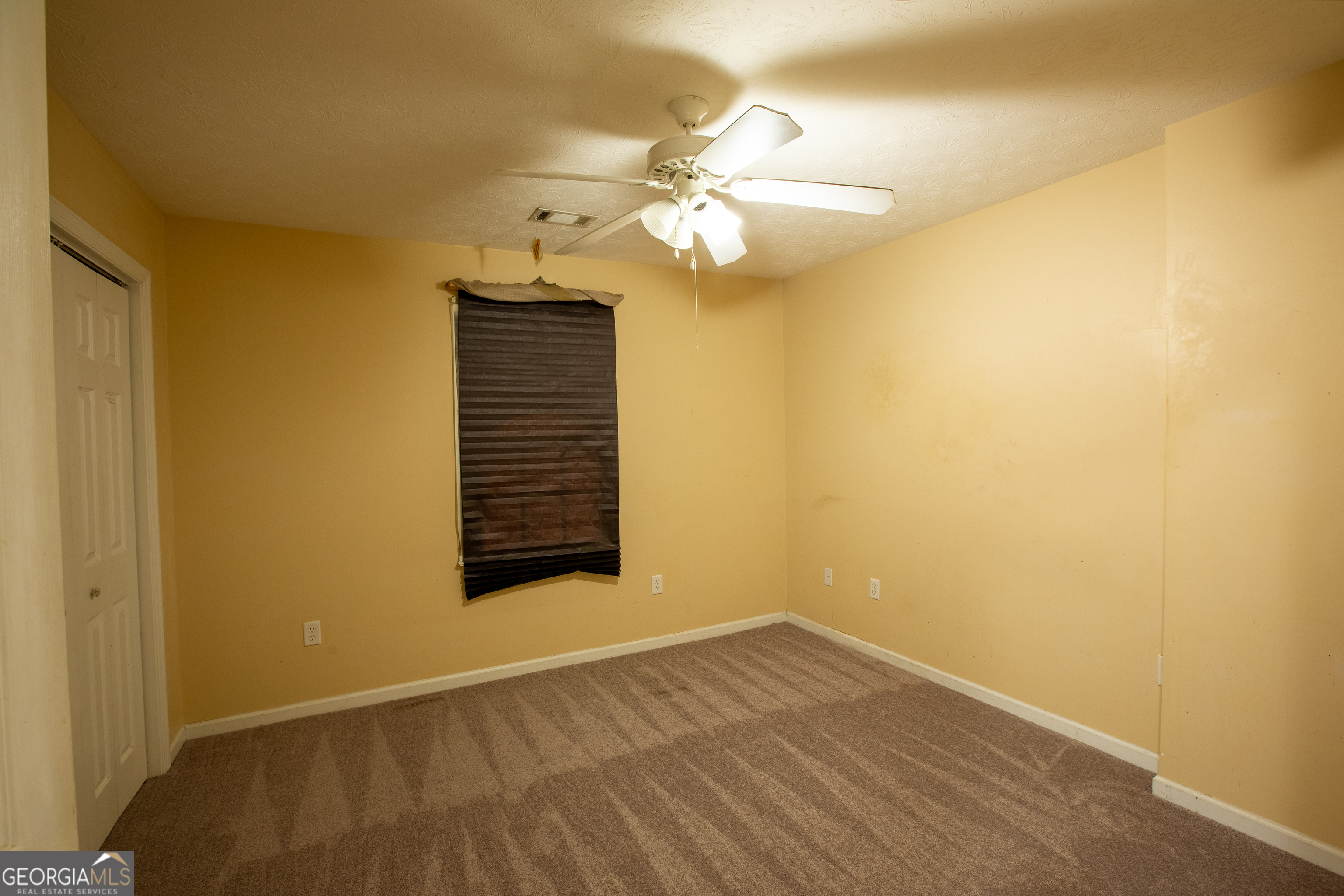2801 8th Street Columbus, GA 31906 - Photo 15 of 20 a view of a room with wooden floor and ceiling fan