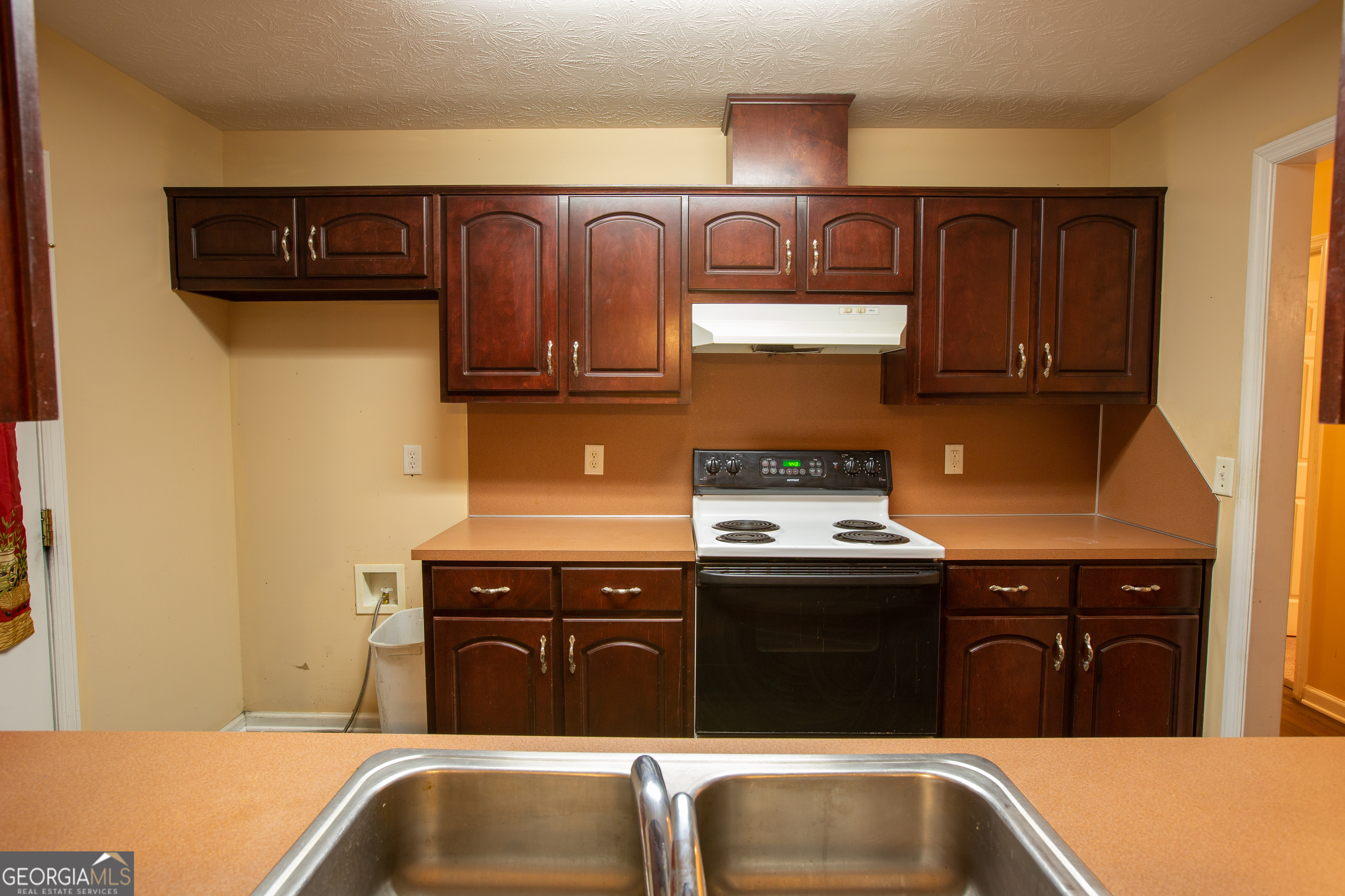2801 8th Street Columbus, GA 31906 - Photo 7 of 20 a kitchen with granite countertop a sink and a stove