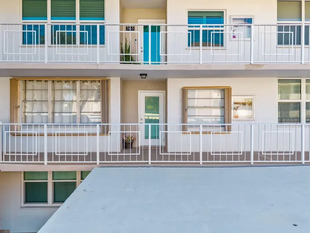 a front view of a building with a glass door