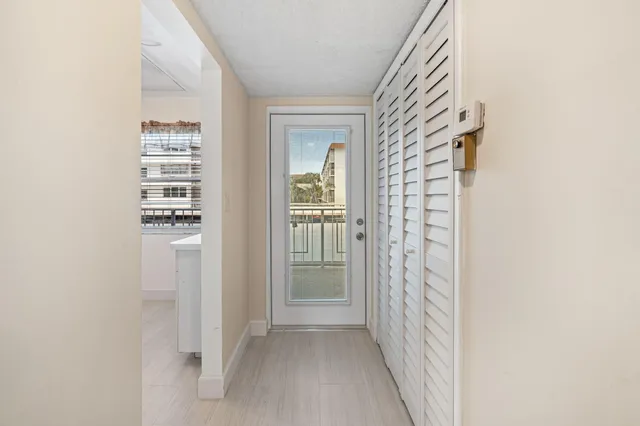 a view of a hallway with windows