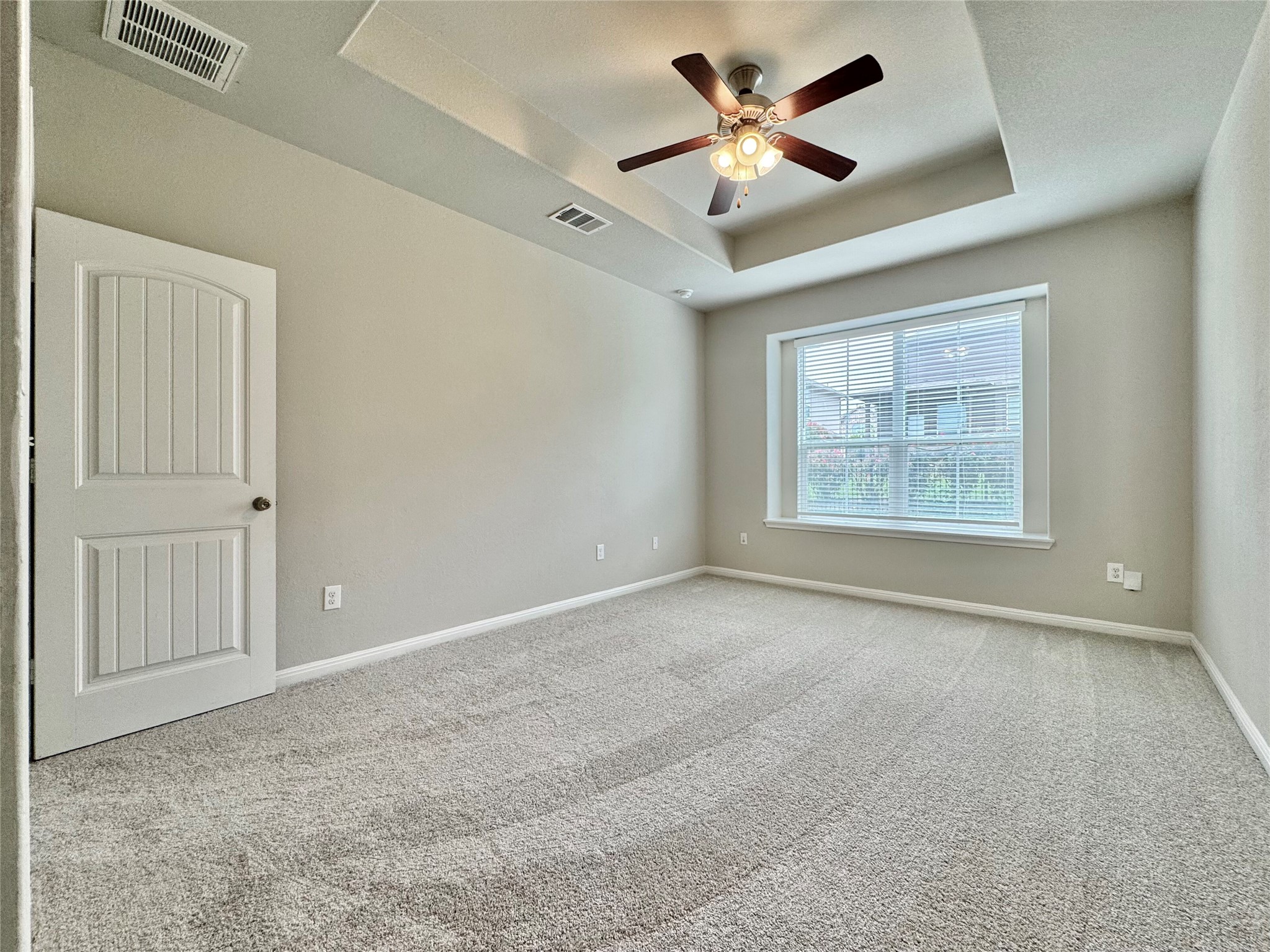 407 Rhetoric Way Pflugerville, TX 78660 - Photo 28 of 38 an empty room with windows and fan