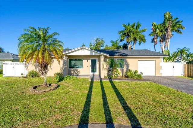 a front view of a house with swimming pool having outdoor seating
