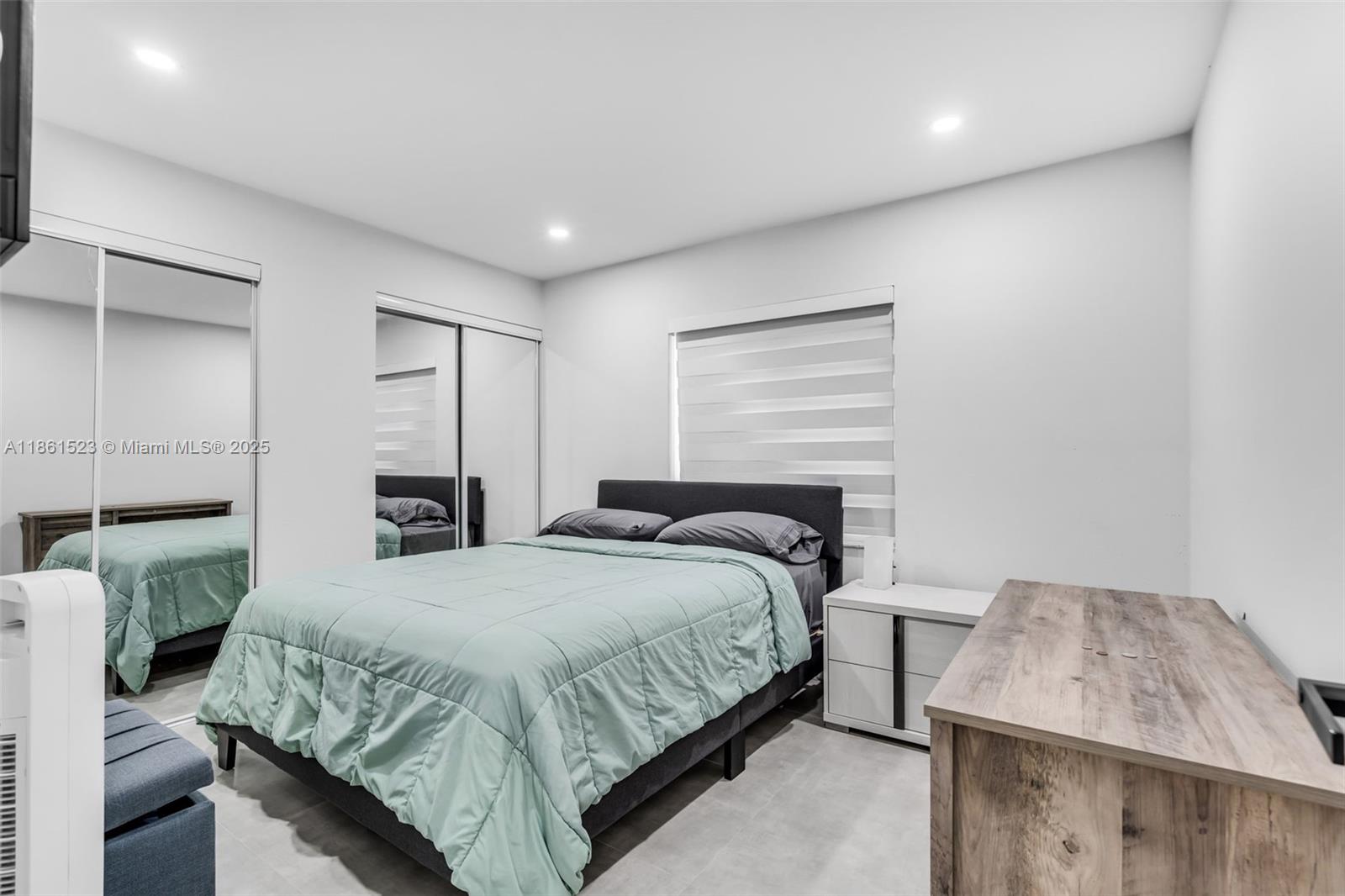 1120 Southwest 128th Drive Davie, FL 33325 - Photo 18 of 38 a bedroom with a bed and a window