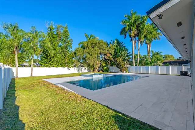 a view of a swimming pool with an outdoor space