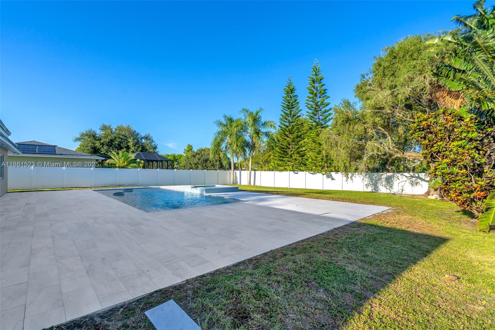 1120 Southwest 128th Drive Davie, FL 33325 - Photo 25 of 38 a view of a big yard with an outdoor space