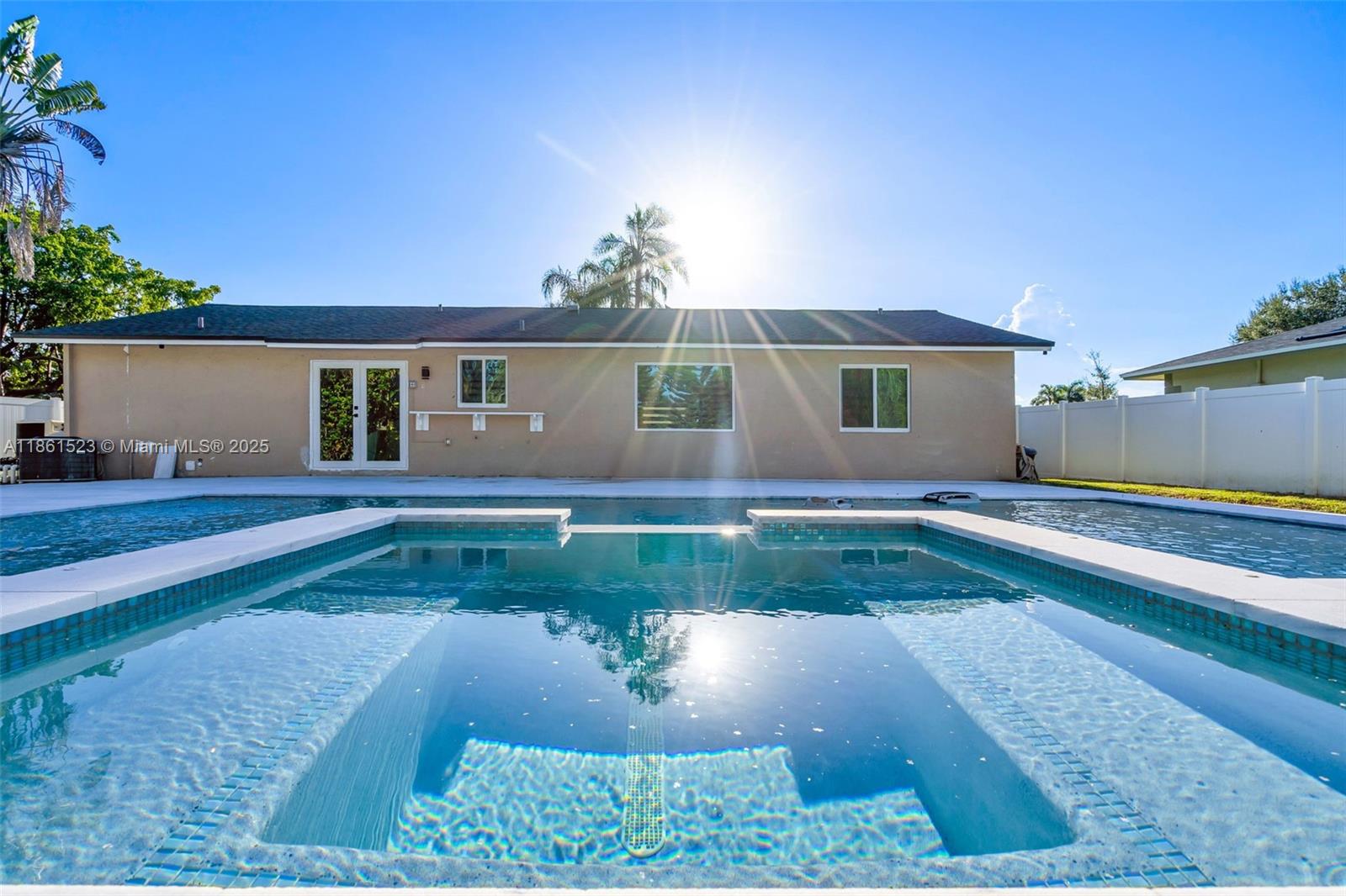 1120 Southwest 128th Drive Davie, FL 33325 - Photo 27 of 38 a front view of a house with garden