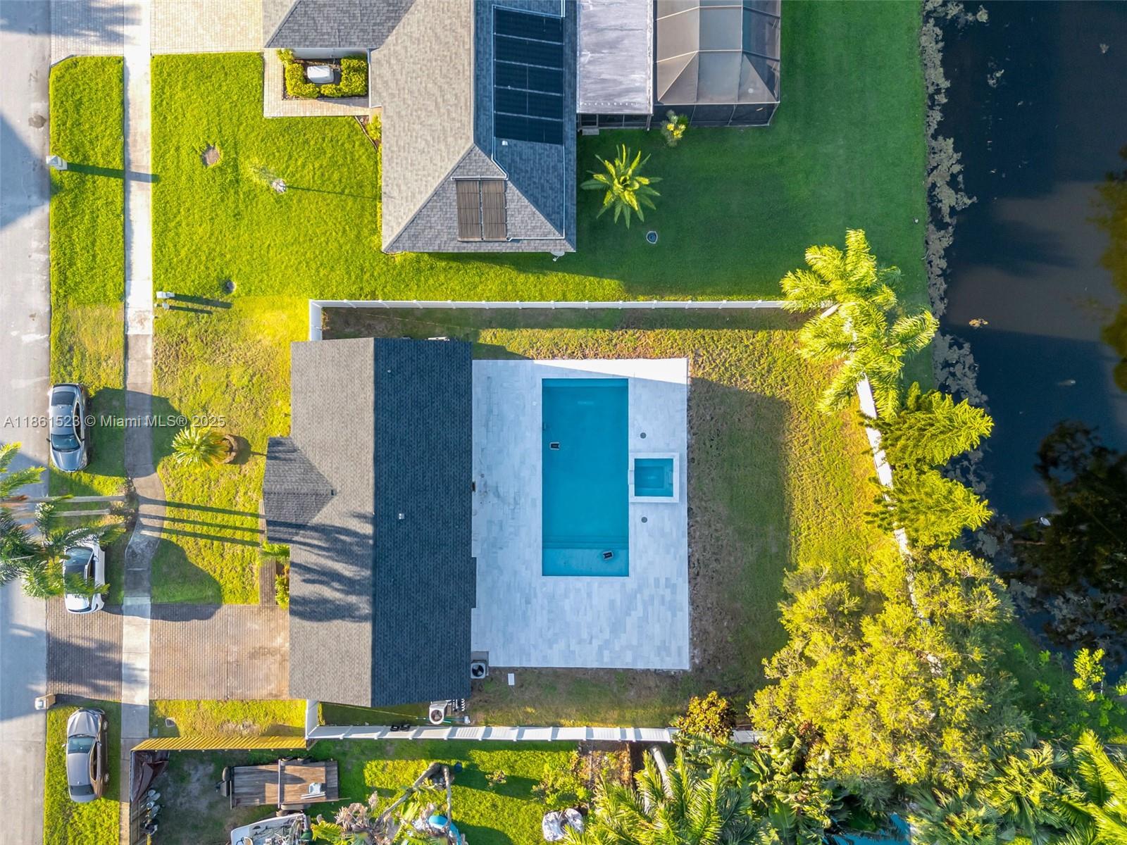 1120 Southwest 128th Drive Davie, FL 33325 - Photo 35 of 38 a front view of a house with swimming pool