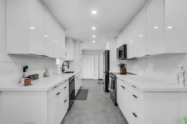 a kitchen with a sink stove and cabinets