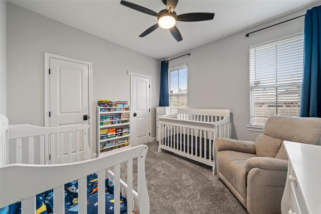 820 Forward Pass Drive Hewitt, TX 76643 - Photo 14 of 22 a bedroom with furniture and a book shelf