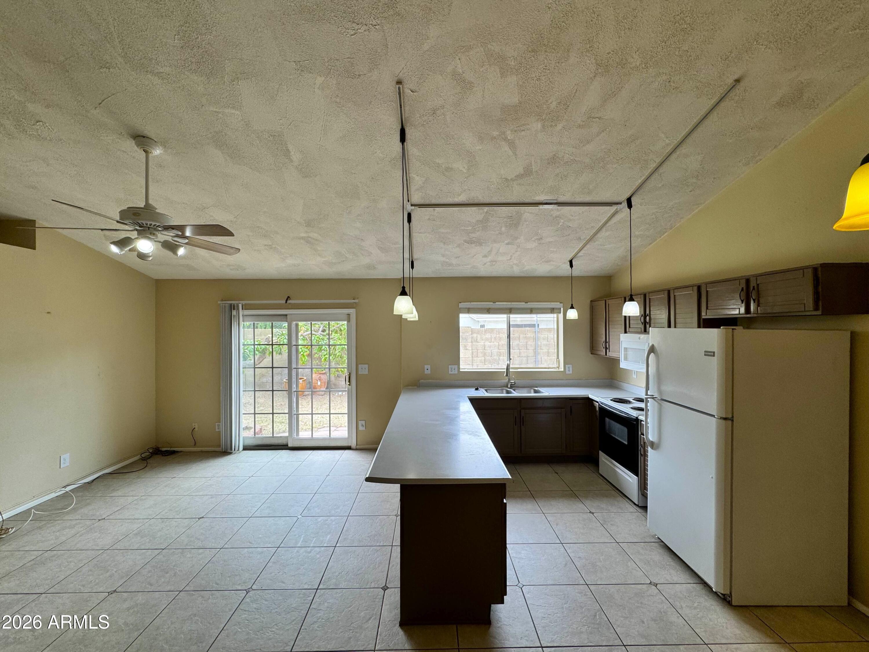 6335 East Brown Road, Unit 1083 Mesa, AZ 85205 - Photo 3 of 15 kitchenliving1FIXED