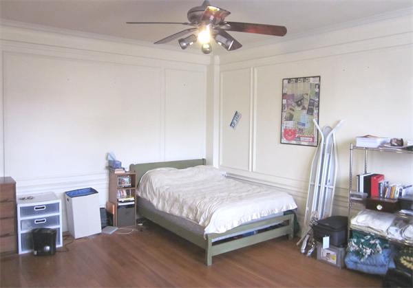 466 Commonwealth Avenue, Unit 604 Boston, MA 02215 - Photo 3 of 8 a bedroom with a bed and a chandelier