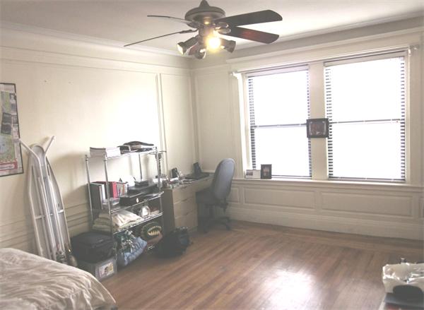 466 Commonwealth Avenue, Unit 604 Boston, MA 02215 - Photo 4 of 8 a living room with furniture and a large window