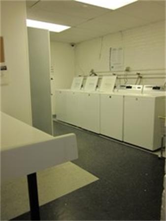 466 Commonwealth Avenue, Unit 604 Boston, MA 02215 - Photo 8 of 8 a utility room with dryer and washer