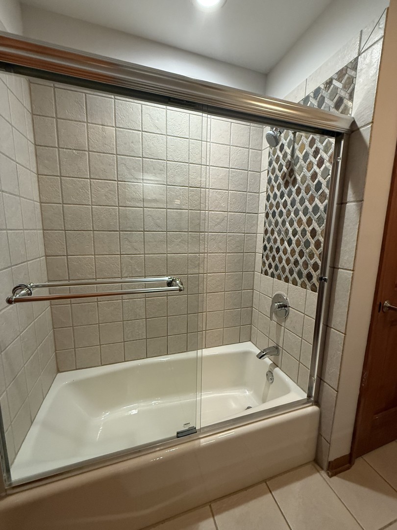 2841 Orange Brace Road Deerfield, IL 60015 - Photo 20 of 30 a bathroom with a bathtub and a shower