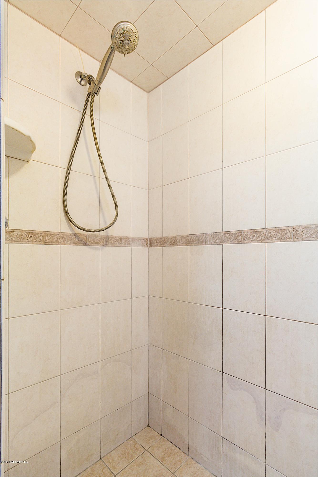 6334 Suwanee Road Jacksonville, FL 32217 - Photo 13 of 17 a bathroom with a shower