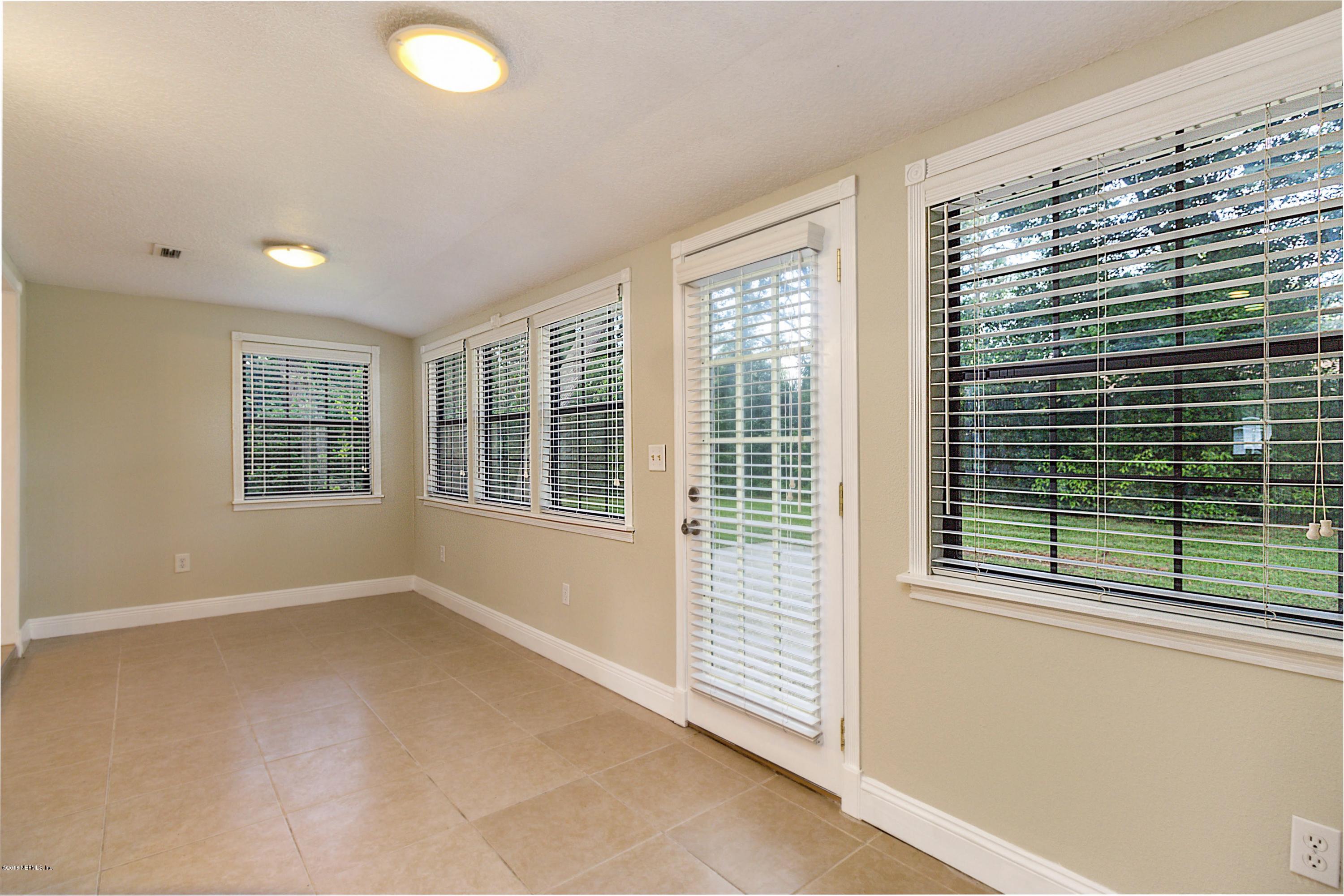 6334 Suwanee Road Jacksonville, FL 32217 - Photo 10 of 17 a view of an empty room with a window