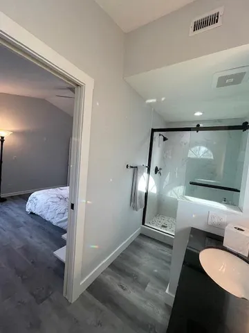 a bathroom with a sink and mirror