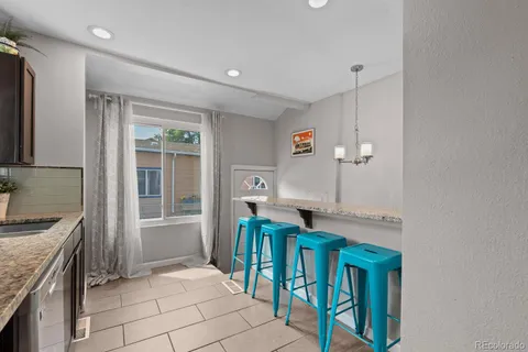 a view of kitchen with furniture and window