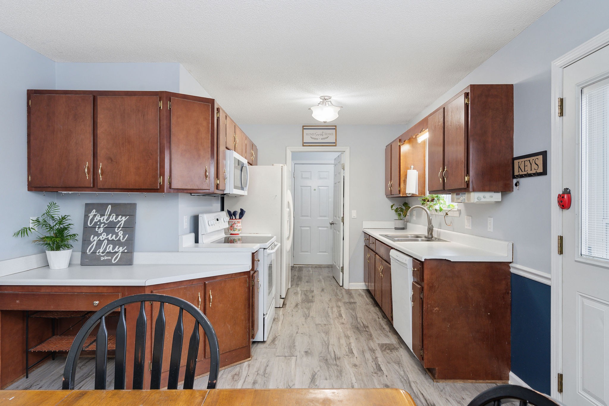 2335 Sawmill Street Murfreesboro, TN 37128 - Photo 11 of 34 a kitchen with stainless steel appliances granite countertop a sink dishwasher stove refrigerator and cabinets
