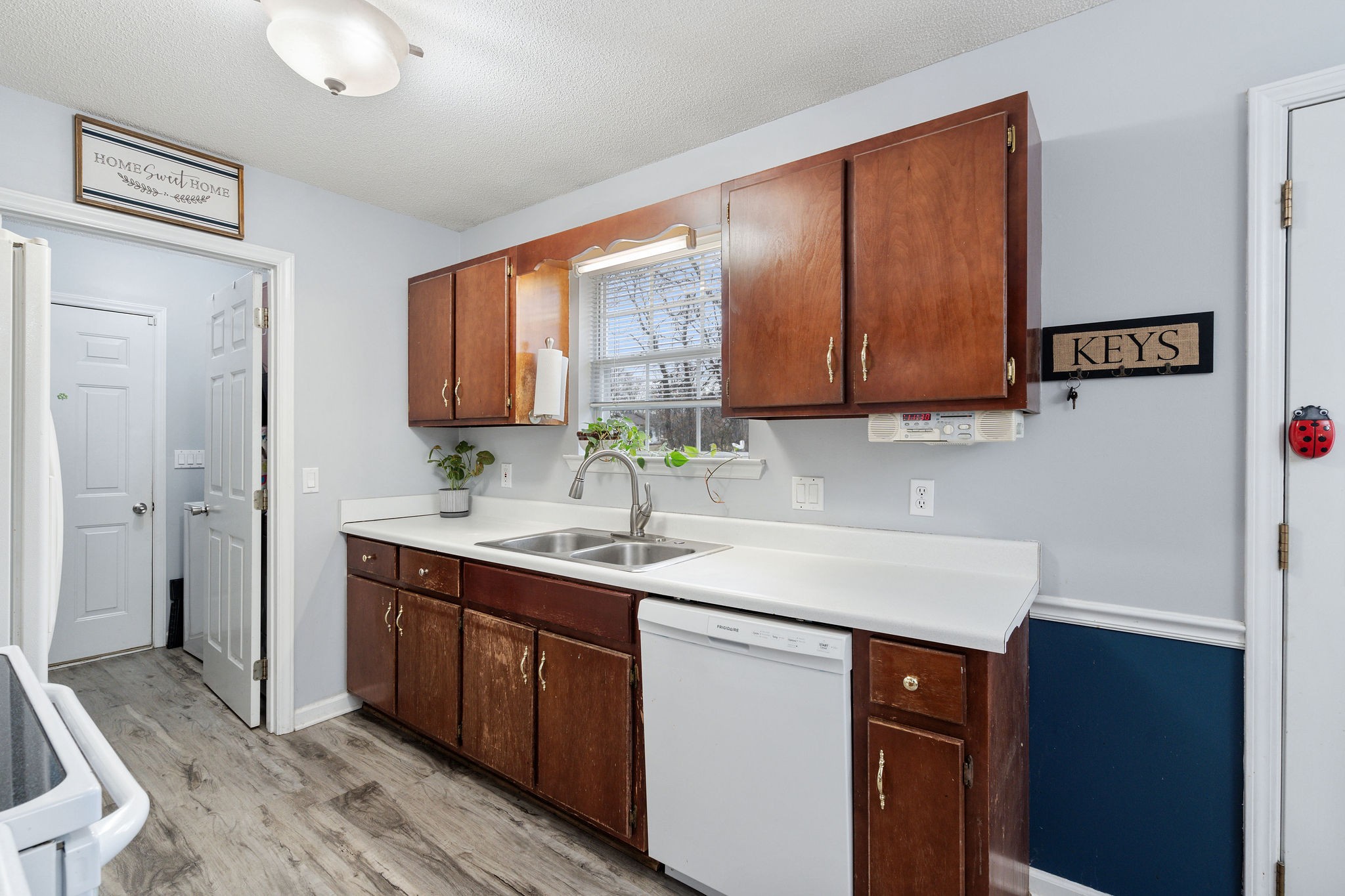 2335 Sawmill Street Murfreesboro, TN 37128 - Photo 14 of 34 a kitchen with a sink cabinets and appliances