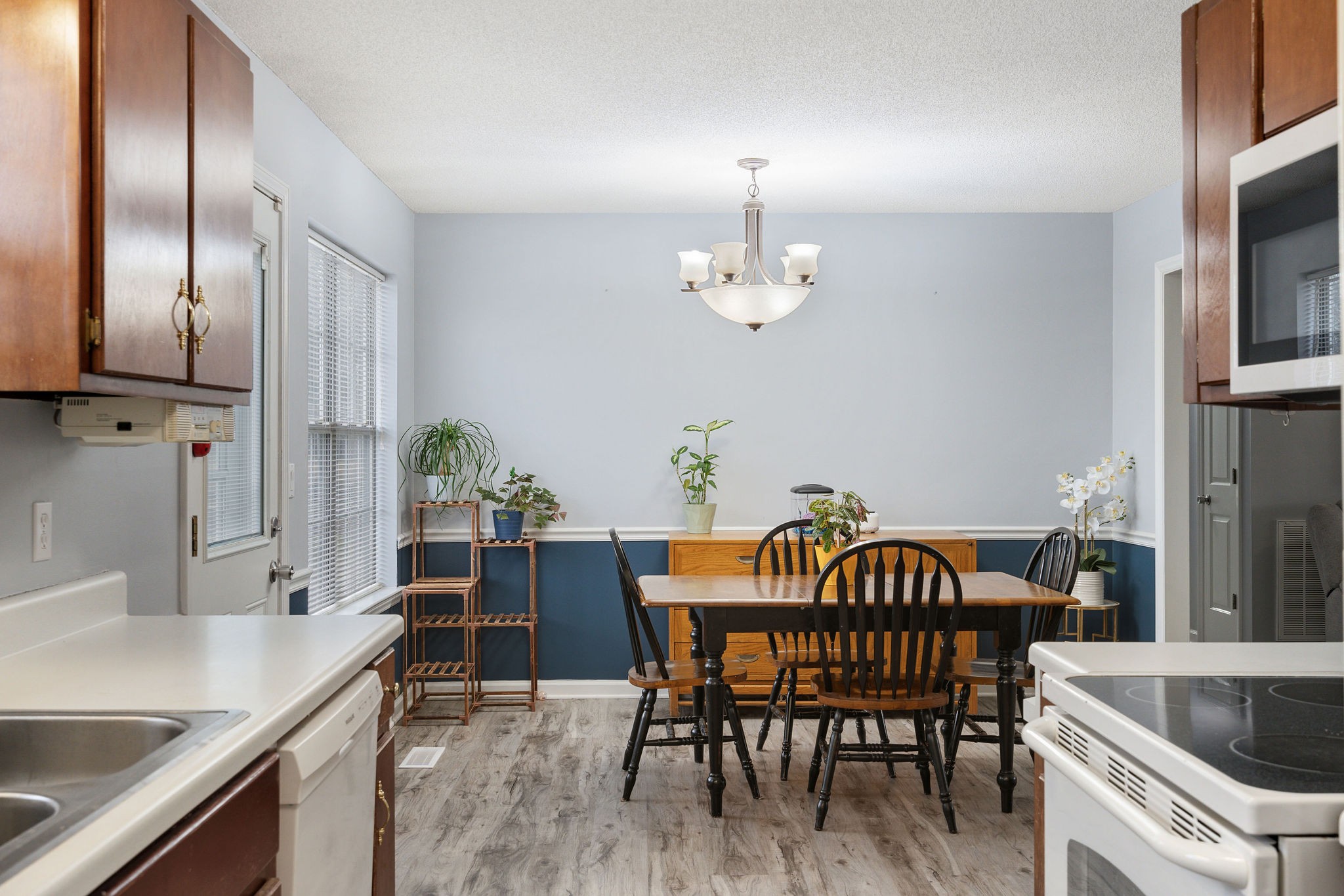 2335 Sawmill Street Murfreesboro, TN 37128 - Photo 15 of 34 a view of a dining room with furniture and chandelier