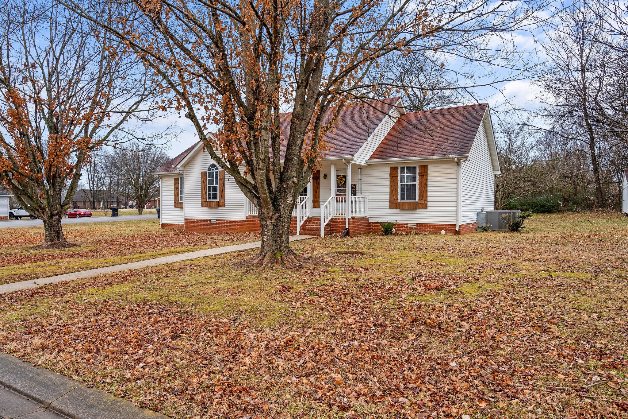 2335 Sawmill Street Murfreesboro, TN 37128 - Photo 3 of 34 a front view of a house with a yard covered in snow