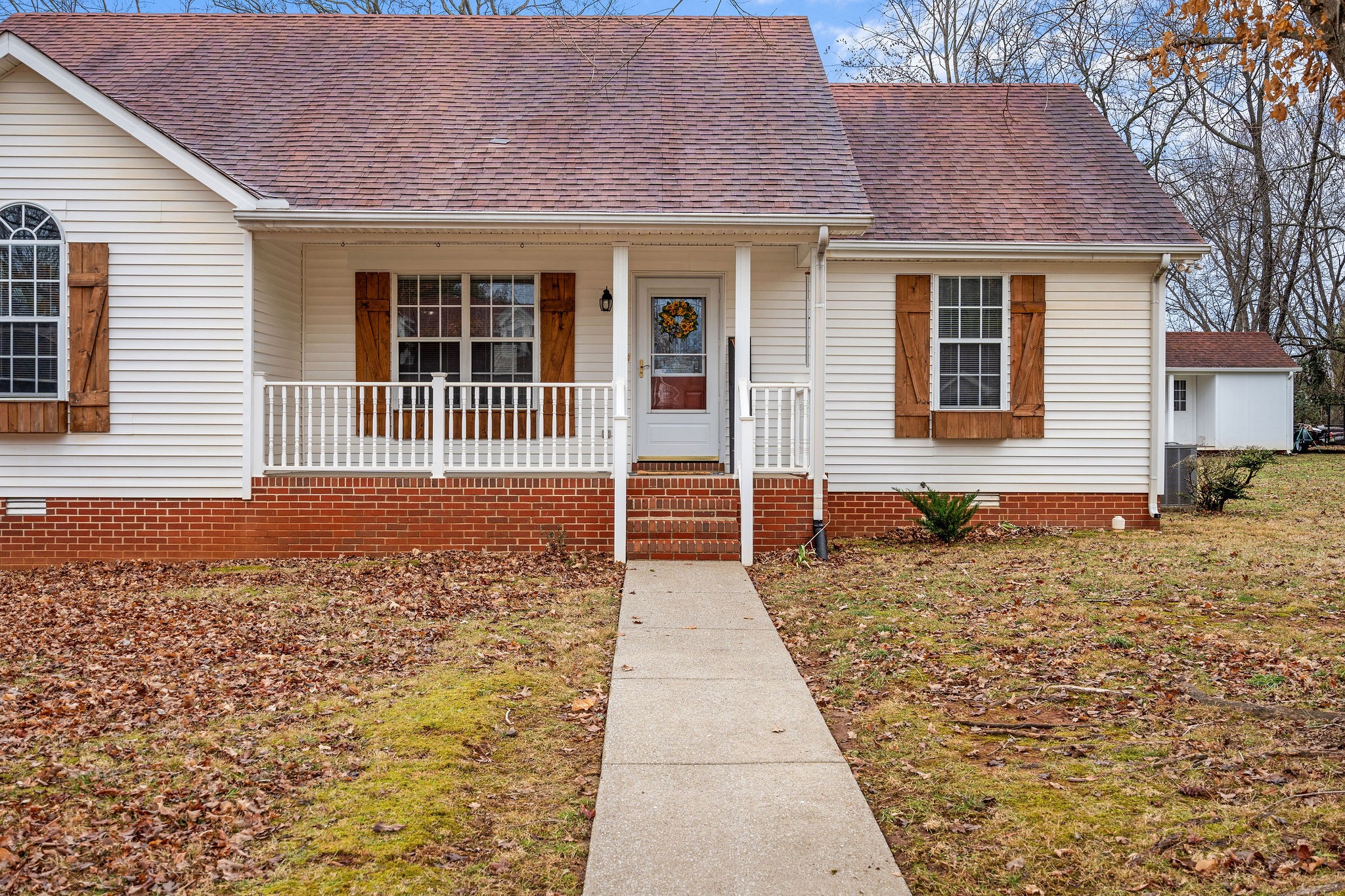 2335 Sawmill Street Murfreesboro, TN 37128 - Photo 5 of 34 a front view of a house with a yard